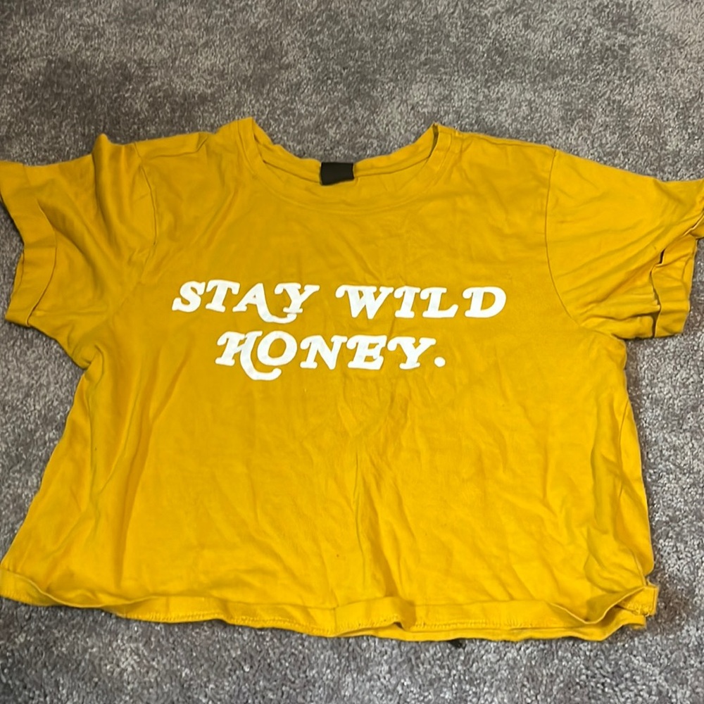 An extra small mustard crop top